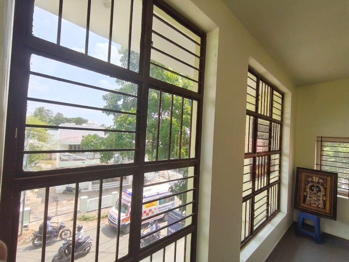 NRT Main Road, Theni, seen from a first-floor commercial unit