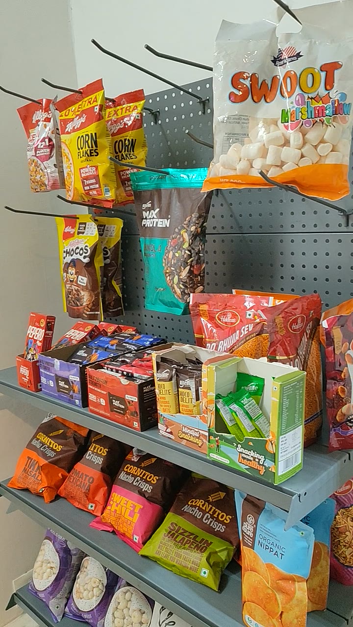 Pegboard rack full of snacks and healthy foods at a pop-up shop at IRL Space, Theni